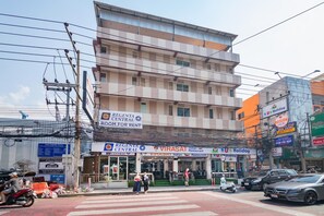 A multi-story building with a sign for 'Regenta Central' indicating it is a room for rent. - Regenta Central Residency (Pattaya)