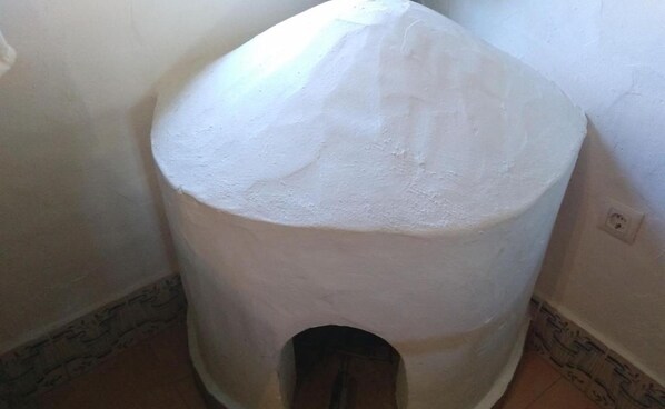A cylindrical structure with a rounded top, possibly a decorative or functional architectural feature.