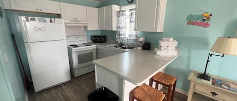 Fridge, microwave, cookware/dishes/utensils