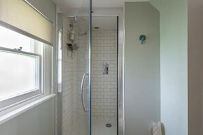 Shower, eco-friendly toiletries, hair dryer, towels