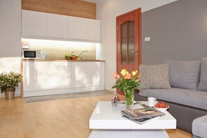 Apartment, 1 Bedroom | Living area | 40-inch LCD TV with satellite channels, TV