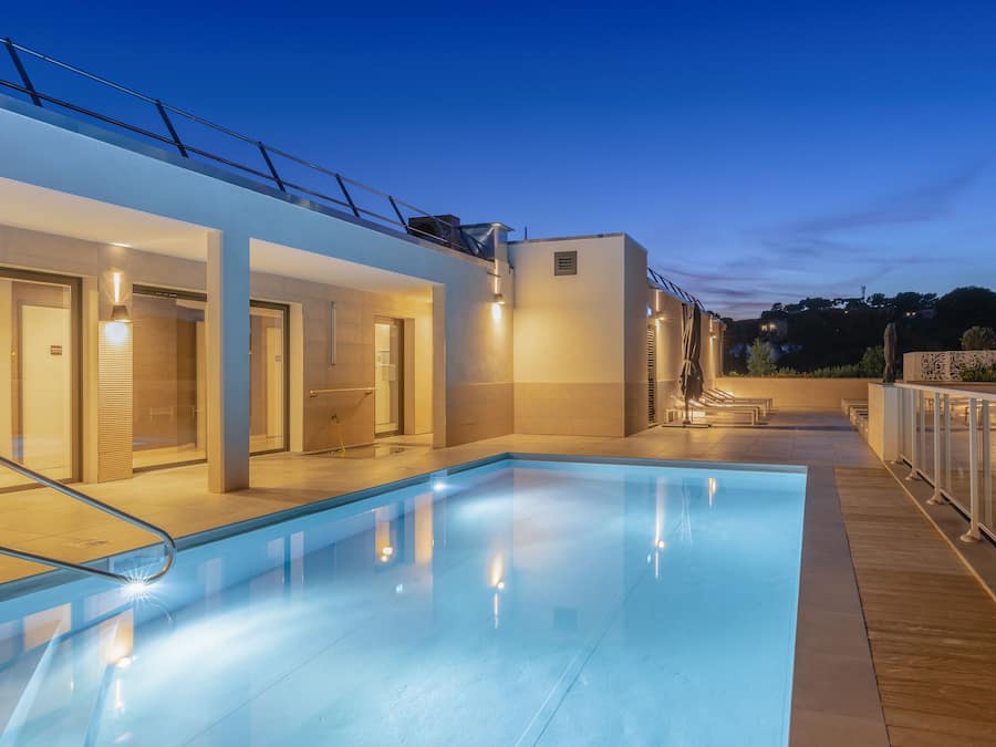 Seasonal outdoor pool, open 10:00 AM to 8:00 PM, pool umbrellas