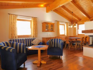 Basic Chalet, 2 Bedrooms | Living area | Flat-screen TV, fireplace, iPod dock, heated floors - Das Resort Brixen (Brixen im Thale)