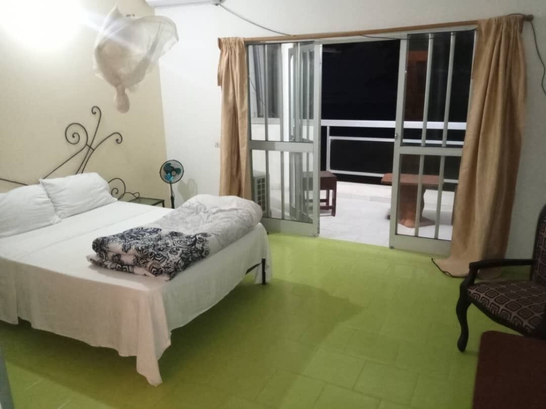 Deluxe Double Room, Partial Sea View | Desk, laptop workspace, blackout drapes, iron/ironing board