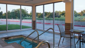 A pool area with a view of a golf course, a table with chairs, and a sign indicating a 3-foot depth. - Fairfield Inn & Suites Duncan (Duncan)