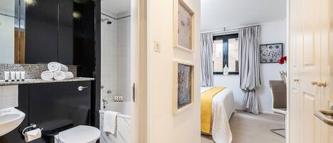 Bathtub, hair dryer, towels, soap