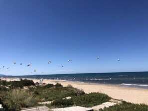 On the beach, sun-loungers