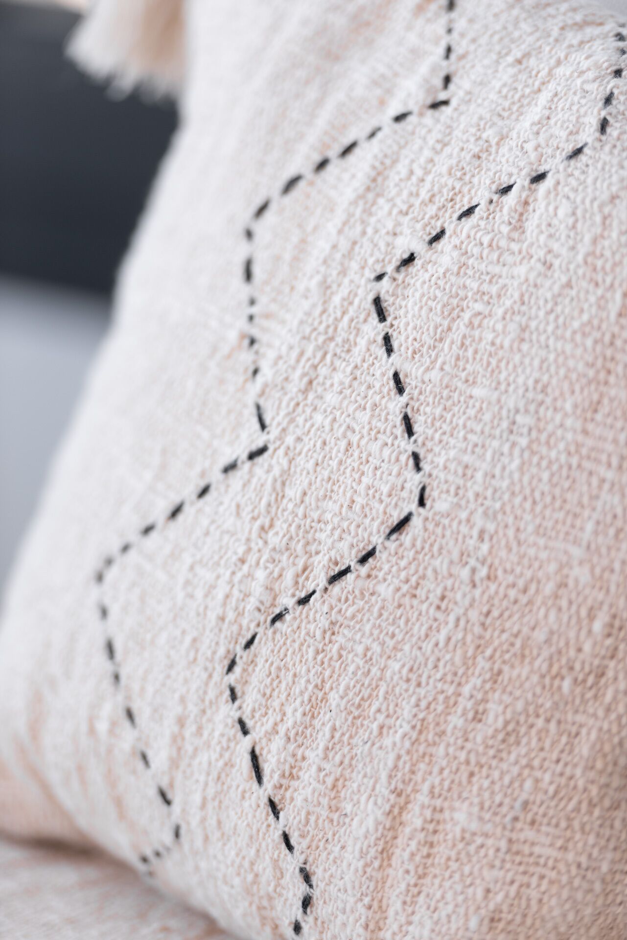 A close-up of a textured fabric with a geometric pattern.