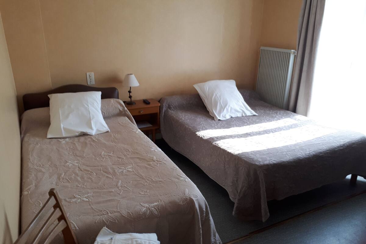 triple room, shared bathroom | free cots/infant beds, free wifi, bed sheets