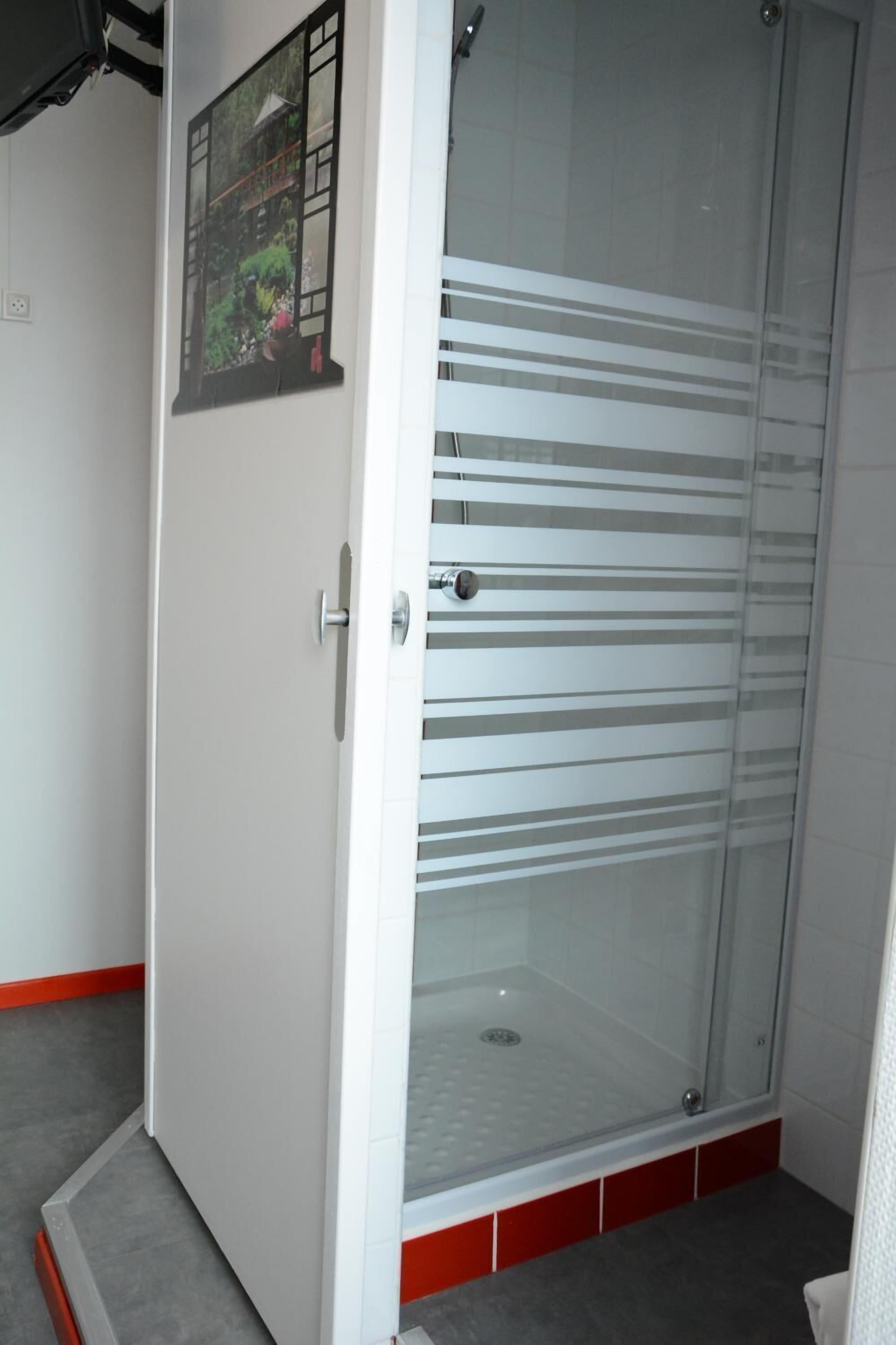 family room, shared bathroom | bathroom | shower, towels