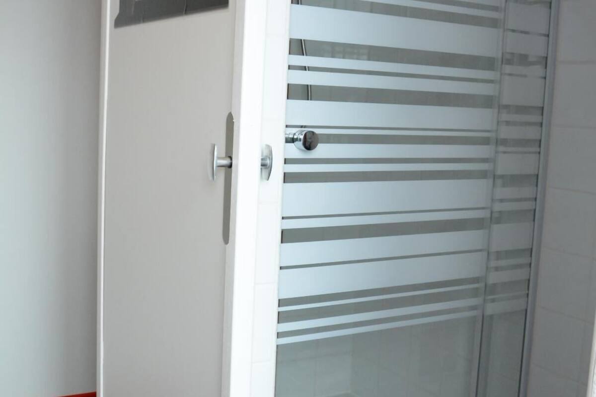 family room, shared bathroom | bathroom | shower, towels