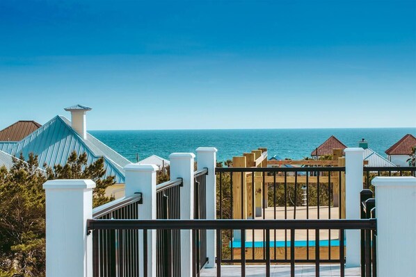 Enjoy breathtaking views of the sea from this coastal property's covered outdoor area.