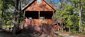 Cozy tiny cabin nestled in a little woodland village – playground, pond and more