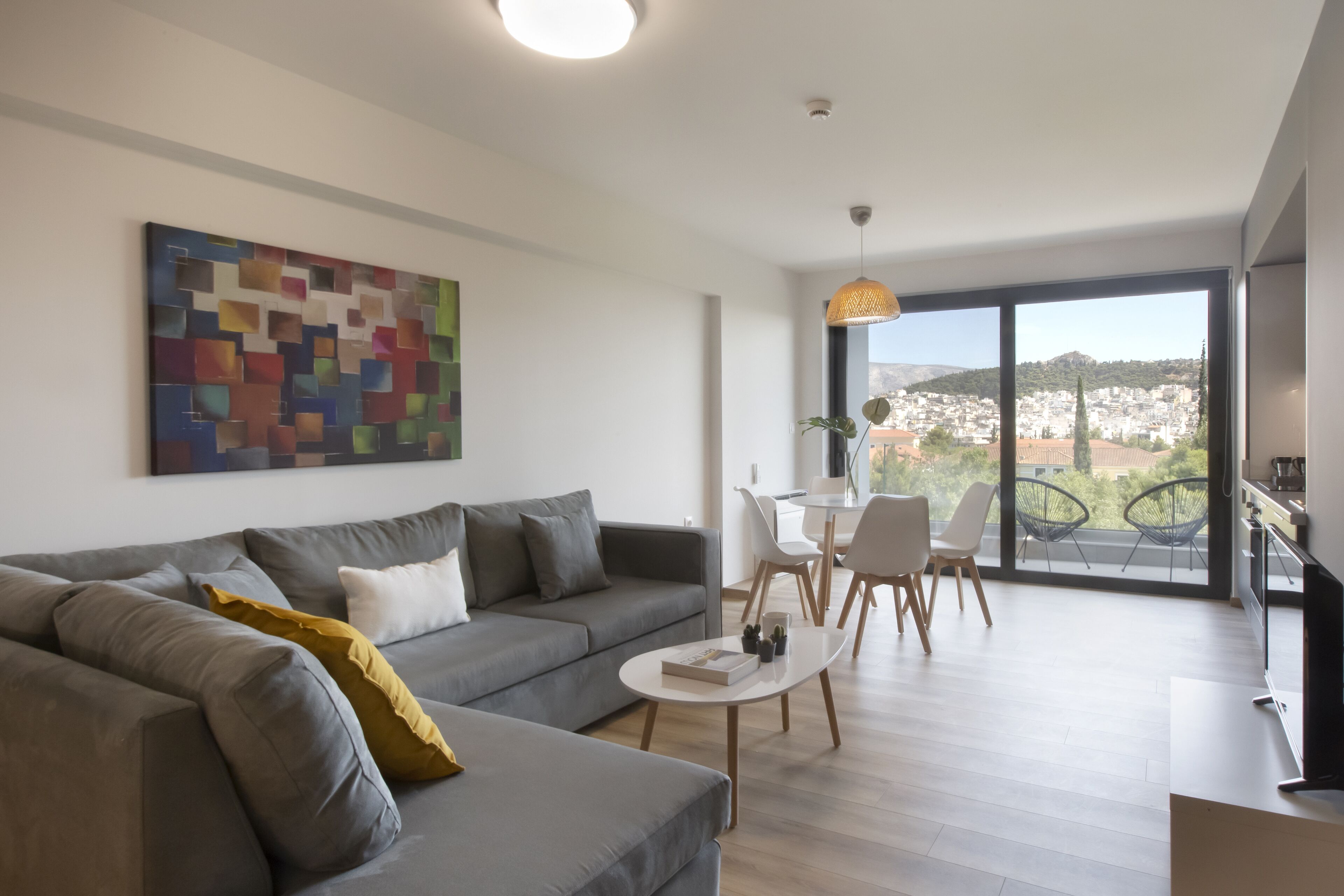 acropolis view executive suite | living area | plasma tv