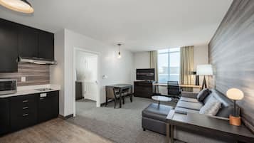 Suite, 1 Bedroom | Desk, laptop workspace, iron/ironing board, free WiFi
