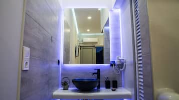 Bathtub, hair dryer, towels, soap