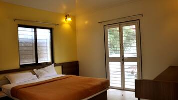 Deluxe Non AC Room | Premium bedding, in-room safe
