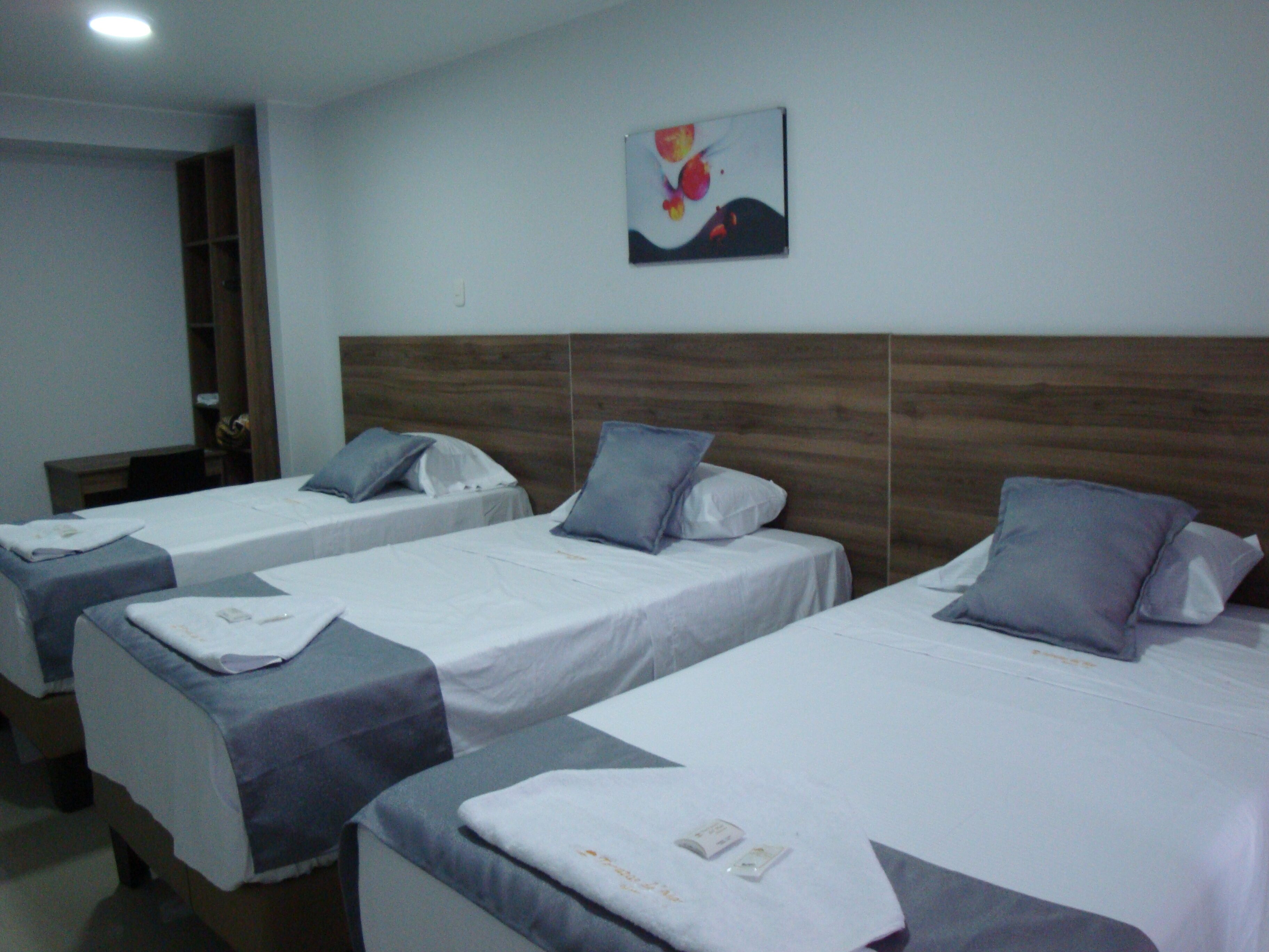 economy triple room | egyptian cotton sheets, premium bedding, down duvets, pillow-top beds