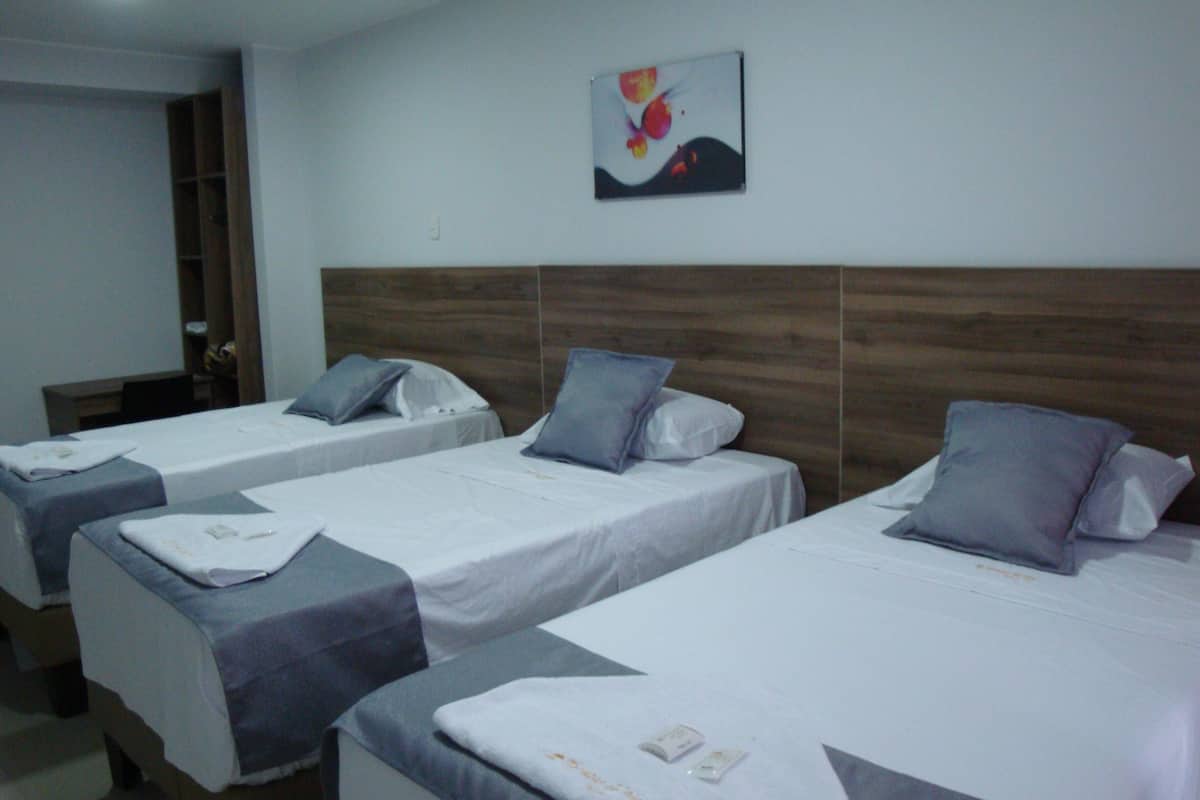 economy triple room | egyptian cotton sheets, premium bedding, down duvets, pillow-top beds