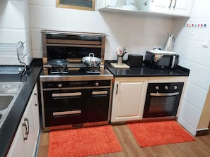 Fridge, microwave, stovetop, dishwasher - Newly furnished and serviced 3-bedroomed apartment (Kilimani)