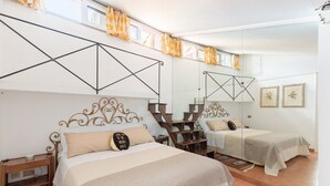 A hotel room with two beds, a large mirror, and a geometric wall design. - Joy Apartment 2 - Rome - Trastevere (Roma)