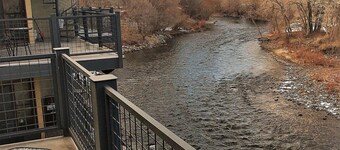 This riverfront downtown condo boasts and open floor plan for kitchen, living room, and dining areas. Or step onto the balcony over the Arkansas River to hear the water rushing by. Oversized master suite has its own balcony and indoor sitting area.