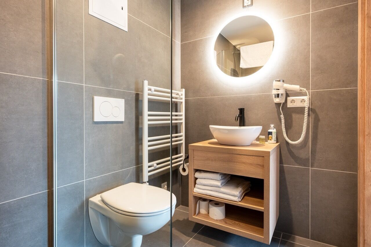 Family Studio | Bathroom | Shower, free toiletries, bathrobes, slippers