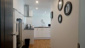 Full-size fridge, microwave, stovetop, coffee/tea maker