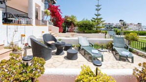 A rooftop terrace with outdoor seating, a pool, and a view of the city. - Sant Maurici by Interhome (Empuriabrava)