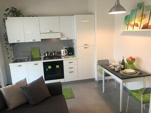 Fridge, oven, coffee/tea maker, electric kettle - SmartSuite apartment with terrace in Stresa (Stresa)