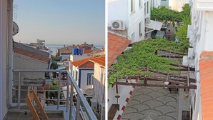 A narrow alleyway with a tiled floor and a metal railing. - Bozcaada Balci Hotel (Bozcaada)