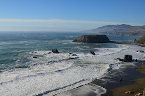 A coastal landscape with a sandy beach, rocky outcrops, and a clear view of the ocean. - The Perfect View ~ (and the Ideal Location!) Walk to  Restaurants. Beach and Mor (Monte Rio)
