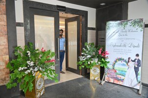 A hotel entrance with a sign reading "Sambandh".