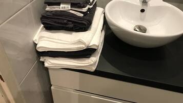 Hair dryer, towels, soap, shampoo