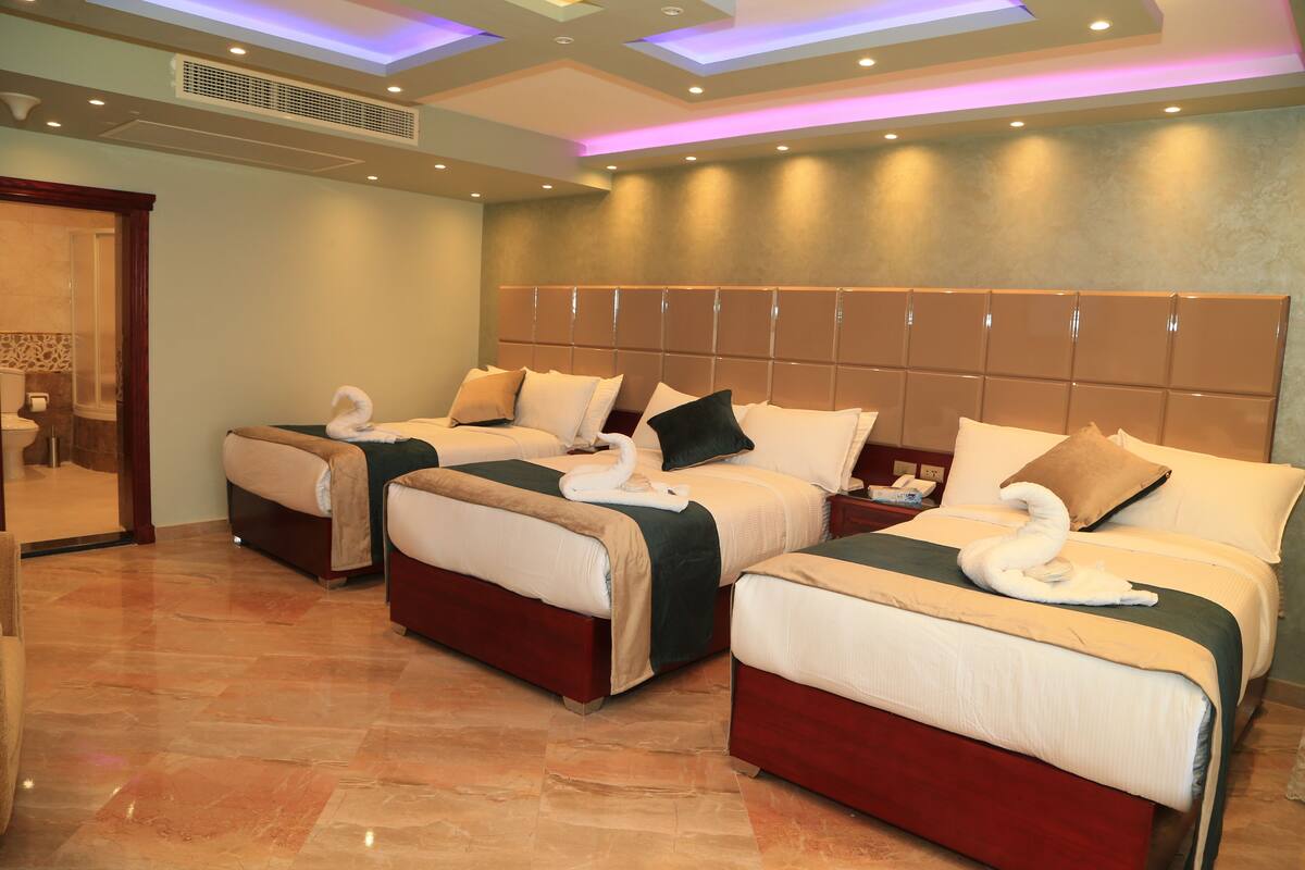 Panoramic Triple Room | Minibar (free items), desk, blackout drapes, soundproofing