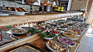 A buffet with various dishes and a honeycomb display. - Wonder of Cappadocia (Nevsehir)