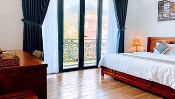 Standard Double Room, Balcony | Living area | 24-inch flat-screen TV with cable channels, TV