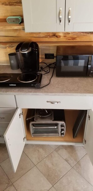 Fridge, microwave, coffee/tea maker, cookware/dishes/utensils