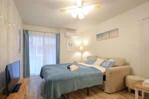 Desk, laptop workspace, blackout curtains, iron/ironing board