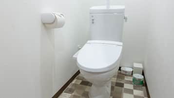 Separate tub and shower, free toiletries, hair dryer, slippers