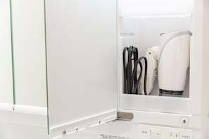 A white appliance with a control panel and a power cord. - Ryugu (Osaka)
