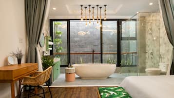 Deluxe Double Room, Bathtub | Bathroom amenities | Separate tub and shower, deep soaking tub, hydromassage showerhead