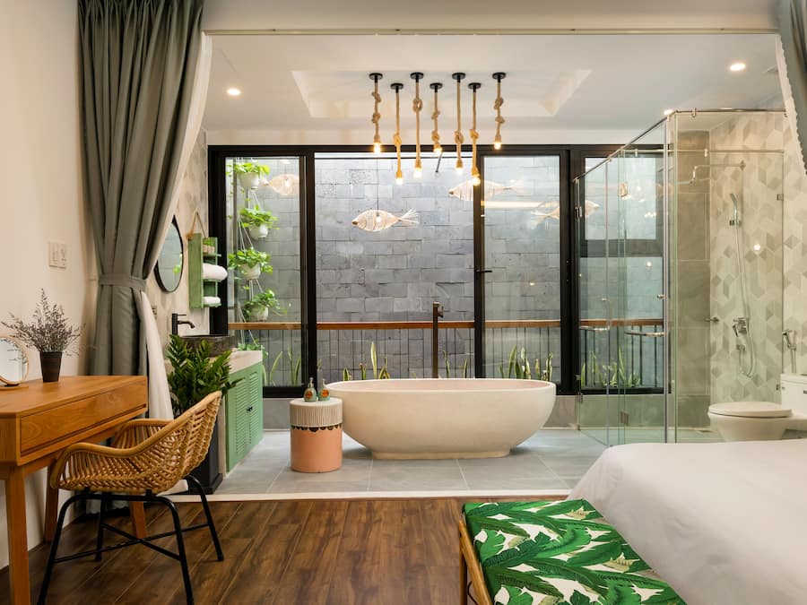 Deluxe Double Room, Bathtub | Bathroom amenities | Separate tub and shower, deep soaking tub, hydromassage showerhead