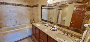 Bathtub, hair dryer, towels, soap