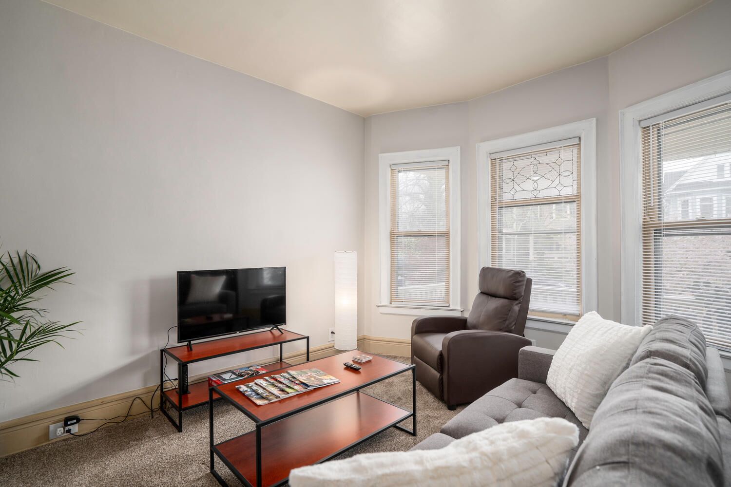 Clean, cozy Elmwood Village apartment with porch