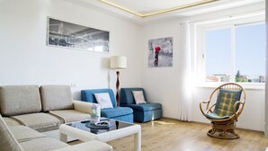 A modern living room with a sofa, armchair, and coffee table. - Apartment near centar-view to port from apartment (Split)