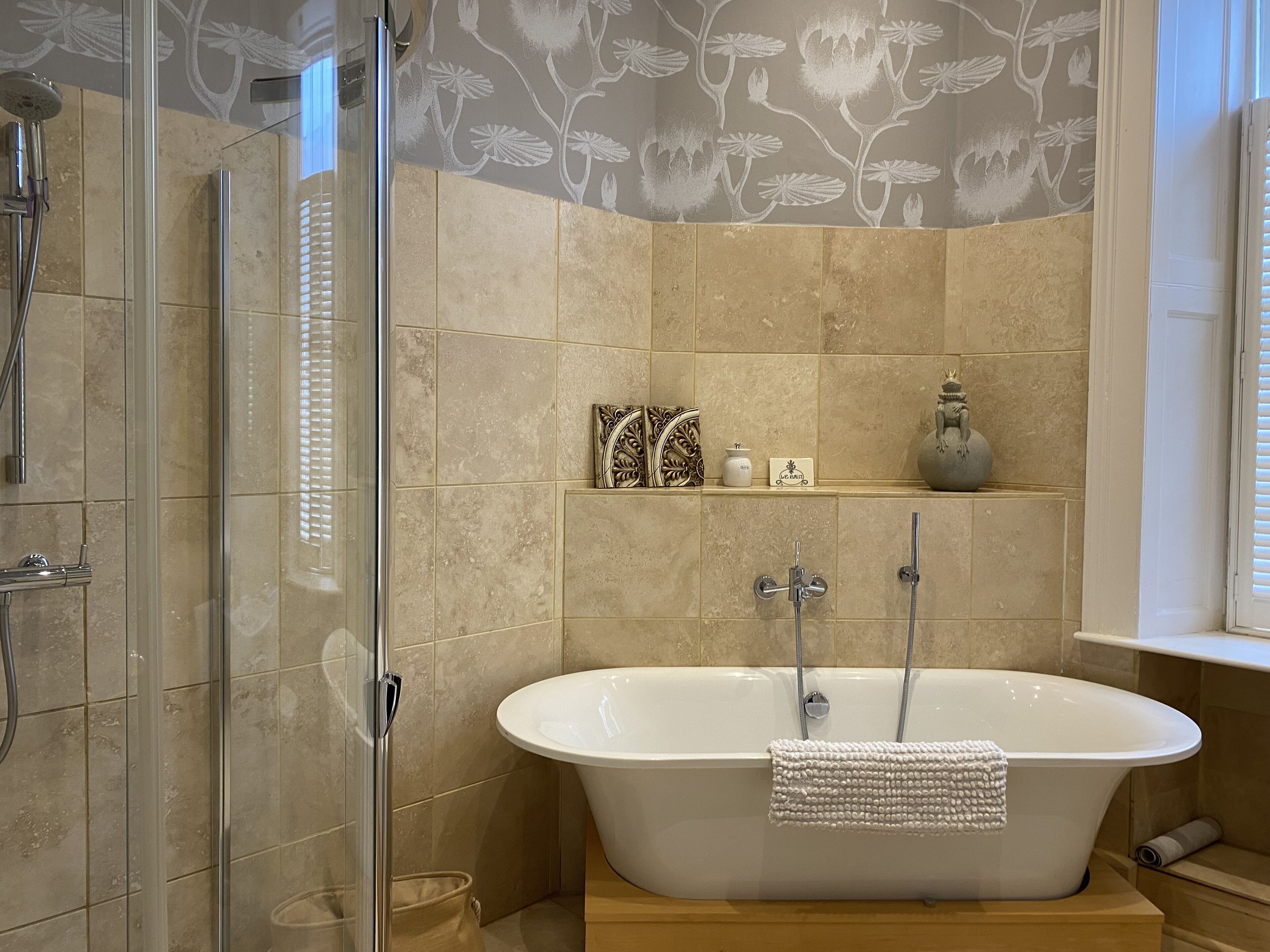 Bathtub, hair dryer, towels, soap
