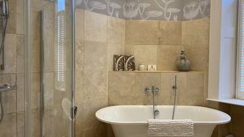 Bathtub, hair dryer, towels, soap