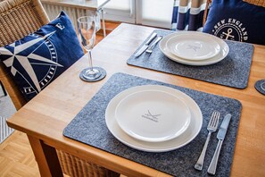 Dining - This comfortably furnished 2-room apartment is located on the 1st floor in the house ``Atlantik'' in Wenningstedt. The beach is just a few minutes' walk from the house and when you come home in the evening, the spacious south-facing balcony invites you... (Wenningstedt)