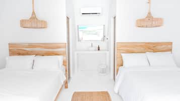 Habitación cuádruple | Ropa de cama de alta calidad, edredón, camas Tempur-Pedic y minibar